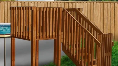 A wooden staircase with a railing on the side of it.