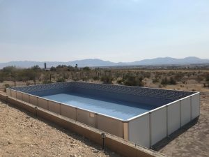 A large metal pool in the middle of nowhere.