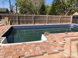 A pool that has been built in the back yard.