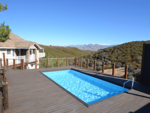 A pool on the deck of a house