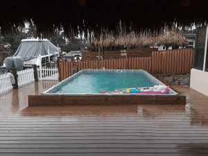 A pool with an umbrella on top of it