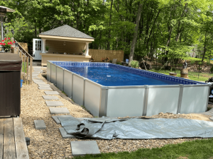 A pool that is being built in the yard.