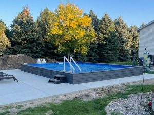 A pool with steps and stairs in the middle of it.